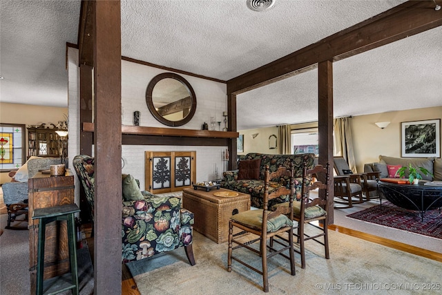 168 Murray Ln, Strang, OK 74367 - living area featuring a textured ceiling and wood finished floors