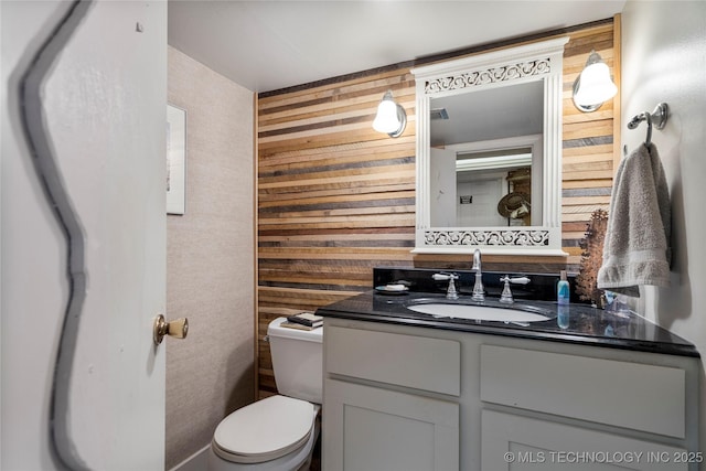 168 Murray Ln, Strang, OK 74367 - half bath featuring vanity, toilet, and wooden walls