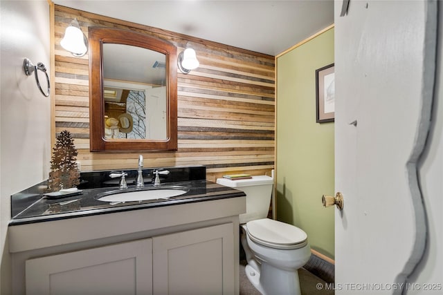 168 Murray Ln, Strang, OK 74367 - half bathroom featuring wooden walls, vanity, and toilet