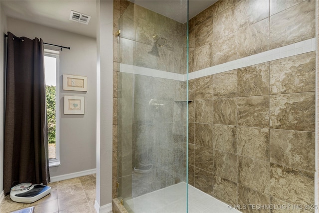168 Murray Ln, Strang, OK 74367 - bathroom with a tile shower, baseboards, and tile patterned floors