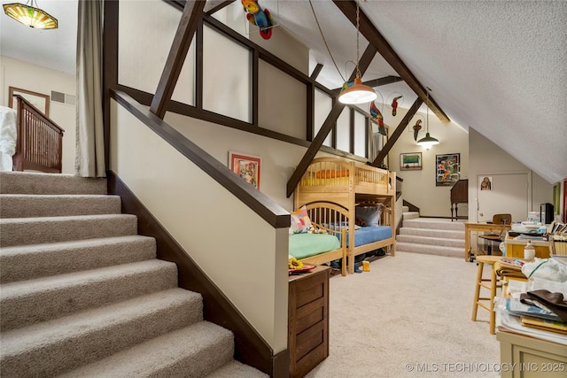 168 Murray Ln, Strang, OK 74367 - bedroom featuring carpet, a textured ceiling, and lofted ceiling