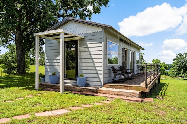 168 Murray Ln, Strang, OK 74367 - view of side of home featuring a lawn and a wooden deck