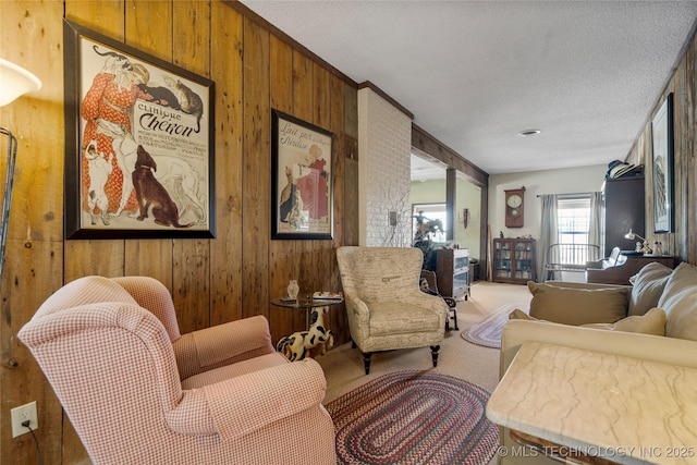 168 Murray Ln, Strang, OK 74367 - living area with wooden walls, carpet flooring, and a textured ceiling