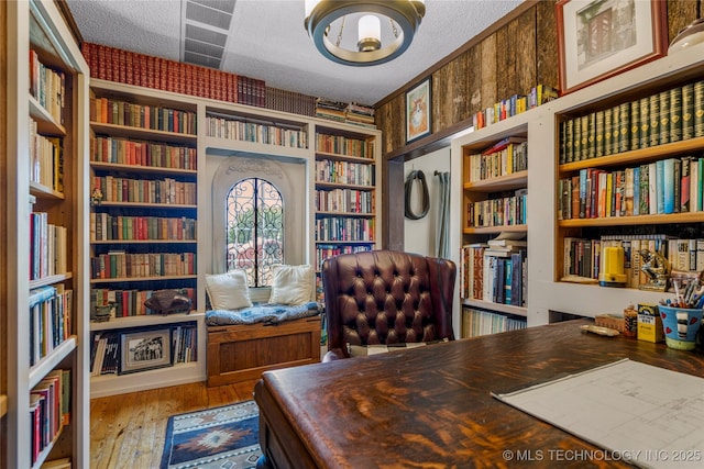 168 Murray Ln, Strang, OK 74367 - office with bookshelves, a textured ceiling, hardwood / wood-style flooring, and built in shelves