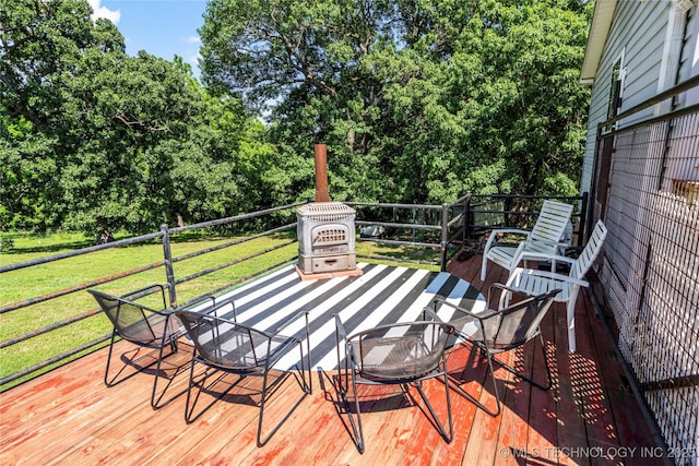 168 Murray Ln, Strang, OK 74367 - wooden deck with a lawn and view of wooded area