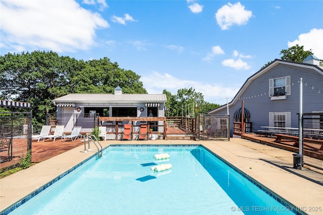 168 Murray Ln, Strang, OK 74367 - community pool with a wooden deck and a patio area