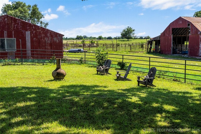 168 Murray Ln, Strang, OK 74367 - view of yard featuring a pole building, an outbuilding, an exterior structure, and a view of countryside