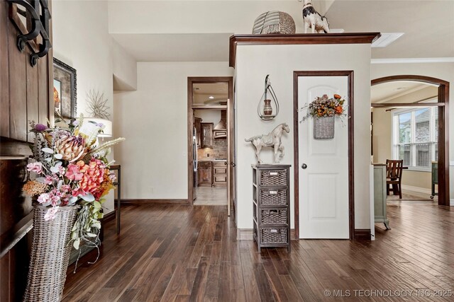 3501 W Gary St S, Broken Arrow, OK 74012 - foyer entrance with arched walkways, dark wood finished floors, and ornamental molding
