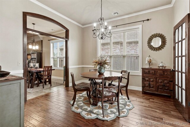 3501 W Gary St S, Broken Arrow, OK 74012 - dining area featuring a chandelier, hardwood / wood-style flooring, and crown molding