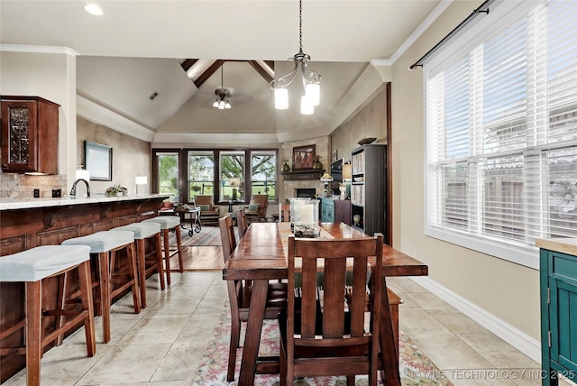3501 W Gary St S, Broken Arrow, OK 74012 - dining room with lofted ceiling, crown molding, a fireplace, and recessed lighting