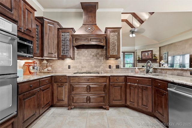 3501 W Gary St S, Broken Arrow, OK 74012 - kitchen with stainless steel appliances, crown molding, premium range hood, decorative backsplash, and a ceiling fan