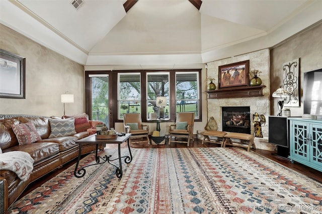 3501 W Gary St S, Broken Arrow, OK 74012 - living area featuring vaulted ceiling, a stone fireplace, wood finished floors, and crown molding
