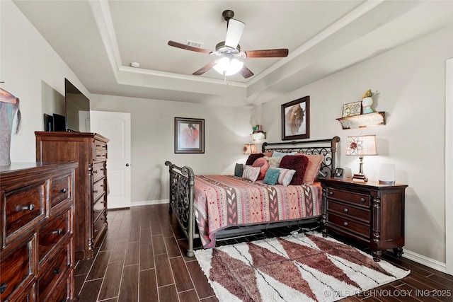 3501 W Gary St S, Broken Arrow, OK 74012 - bedroom featuring a raised ceiling, dark wood finished floors, crown molding, and a ceiling fan