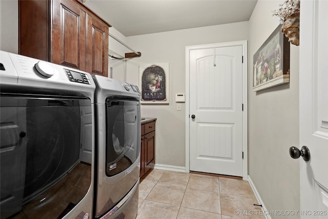 3501 W Gary St S, Broken Arrow, OK 74012 - laundry area with washer and dryer, cabinet space, and light tile patterned flooring