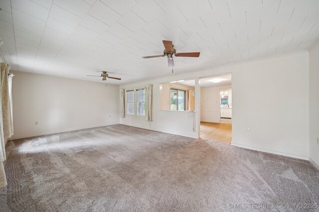 915 N Boudinot Ave, Dewey, OK 74029 - carpeted empty room featuring ceiling fan and baseboards