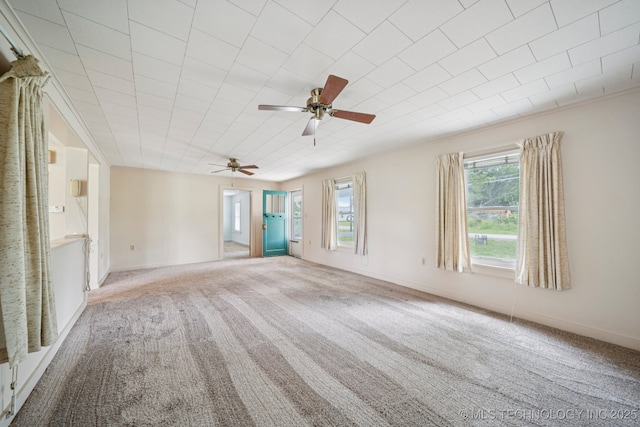 915 N Boudinot Ave, Dewey, OK 74029 - empty room with carpet flooring, ceiling fan, and baseboards