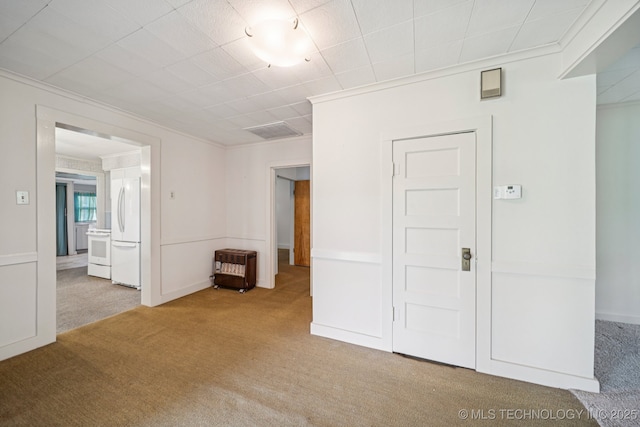 915 N Boudinot Ave, Dewey, OK 74029 - carpeted empty room with ornamental molding