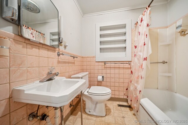 915 N Boudinot Ave, Dewey, OK 74029 - bathroom featuring toilet, crown molding, tile walls, shower / bathtub combination with curtain, and tile patterned flooring