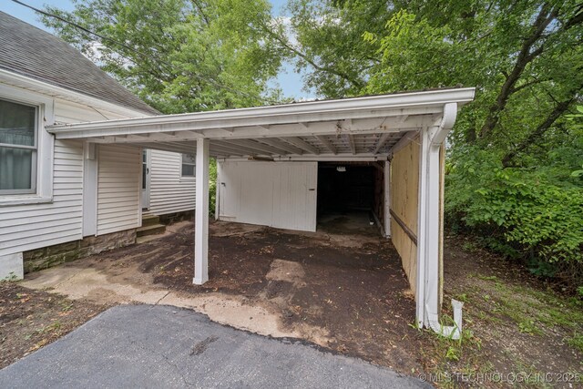 915 N Boudinot Ave, Dewey, OK 74029 - view of car parking featuring a carport