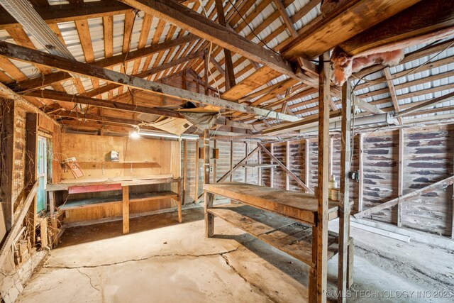 915 N Boudinot Ave, Dewey, OK 74029 - miscellaneous room with vaulted ceiling and concrete floors