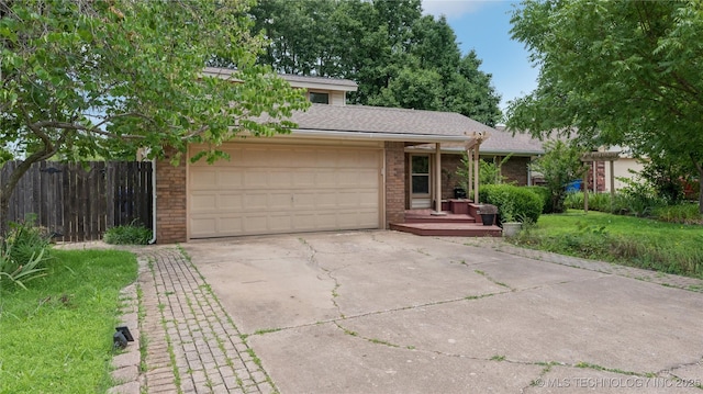3021 S Ash Ave, Broken Arrow, OK 74012 - view of front of home with concrete driveway, an attached garage, brick siding, and roof with shingles