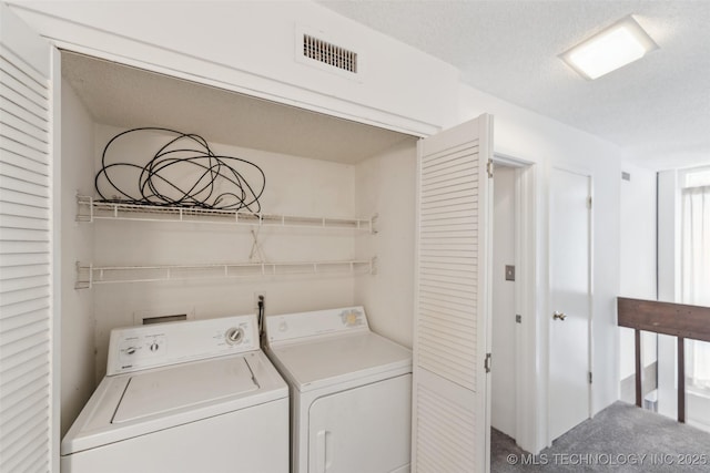 410 W 7th St Unit 241, Tulsa, OK 74119 - washroom with washer and dryer, a textured ceiling, and carpet floors