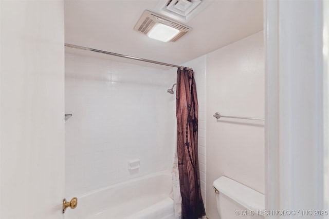 410 W 7th St Unit 241, Tulsa, OK 74119 - bathroom featuring toilet and shower / bath combo with shower curtain