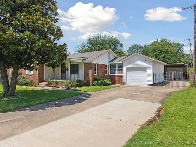 3218 S Kingston Ave, Tulsa, OK 74135 - view of front of house with driveway, an attached garage, brick siding, and a porch