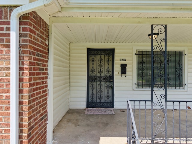 3218 S Kingston Ave, Tulsa, OK 74135 - view of exterior entry featuring a porch and brick siding