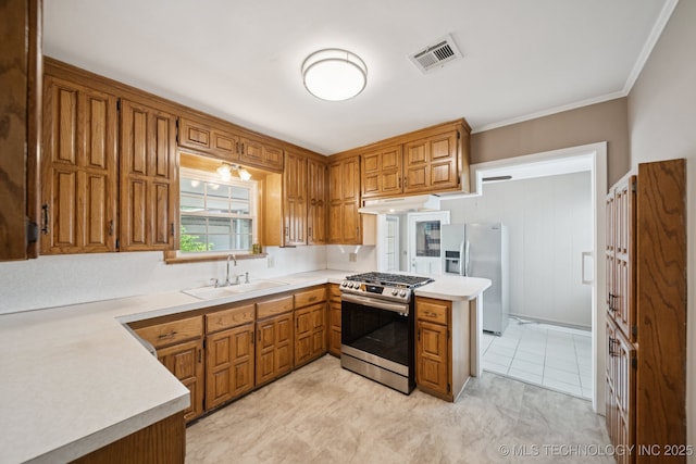3218 S Kingston Ave, Tulsa, OK 74135 - kitchen featuring stainless steel range with gas cooktop, refrigerator with ice dispenser, under cabinet range hood, brown cabinets, and light countertops