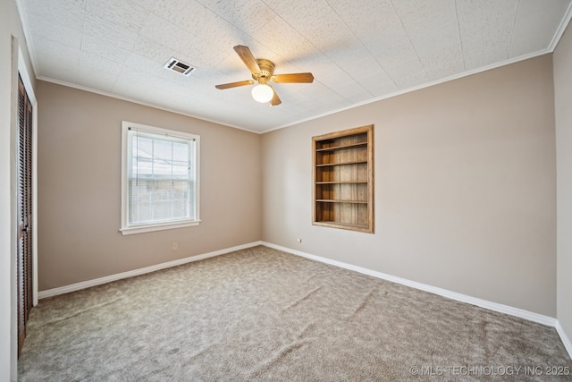 3218 S Kingston Ave, Tulsa, OK 74135 - spare room featuring built in features, ornamental molding, carpet flooring, and a ceiling fan