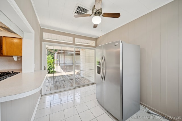 3218 S Kingston Ave, Tulsa, OK 74135 - kitchen with stainless steel fridge with ice dispenser, ceiling fan, light tile patterned floors, crown molding, and light countertops