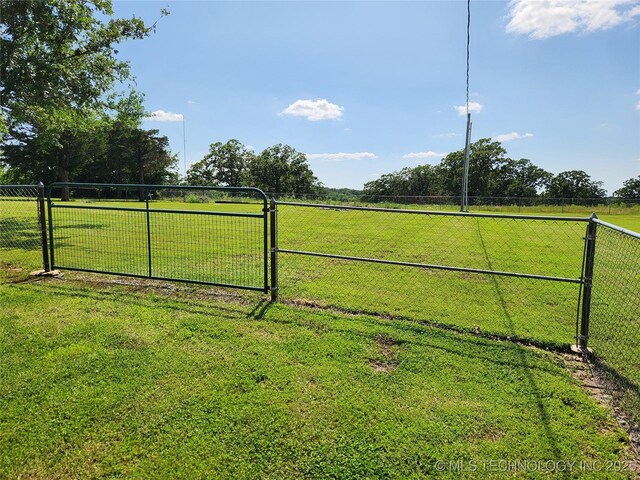 307 N W St, Mcalester, OK 74501 - view of yard featuring a gate