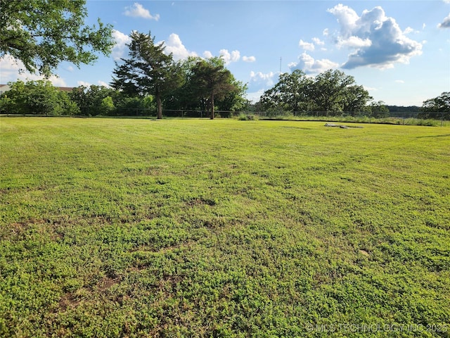 307 N W St, Mcalester, OK 74501 - view of grassy yard featuring a view of rural / pastoral area