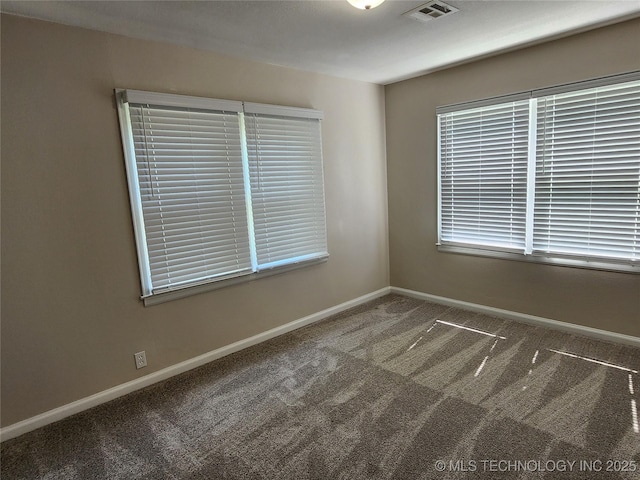 307 N W St, Mcalester, OK 74501 - spare room with carpet and baseboards