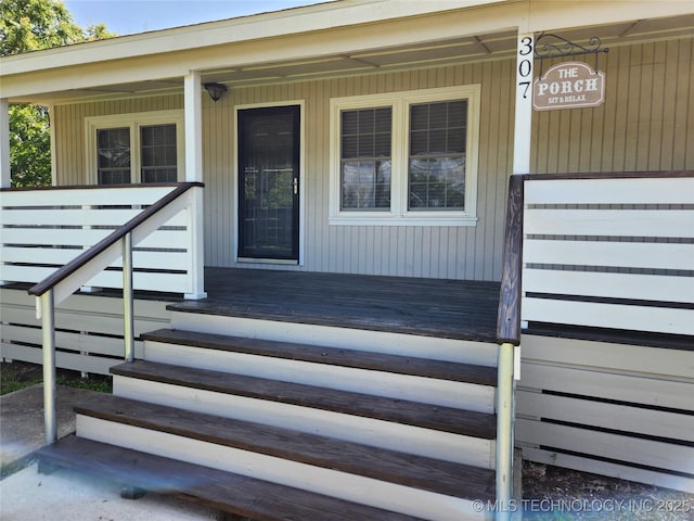 307 N W St, Mcalester, OK 74501 - doorway to property with a porch