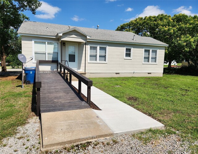307 N W St, Mcalester, OK 74501 - view of front facade featuring crawl space, a front lawn, and roof with shingles