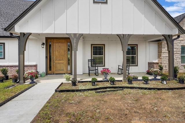 30185 N 3994th Dr, Ramona, OK 74061 - view of front of house with covered porch, board and batten siding, and roof with shingles