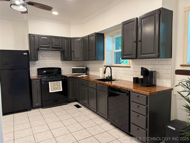 2109 Delaware St, Muskogee, OK 74403 - kitchen with black appliances, a sink, ornamental molding, ceiling fan, and decorative backsplash