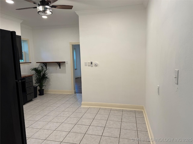 2109 Delaware St, Muskogee, OK 74403 - spare room with ceiling fan, light tile patterned floors, crown molding, and baseboards