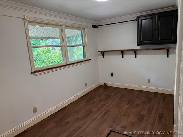 2109 Delaware St, Muskogee, OK 74403 - laundry room featuring baseboards, dark wood-type flooring, cabinet space, hookup for an electric dryer, and crown molding