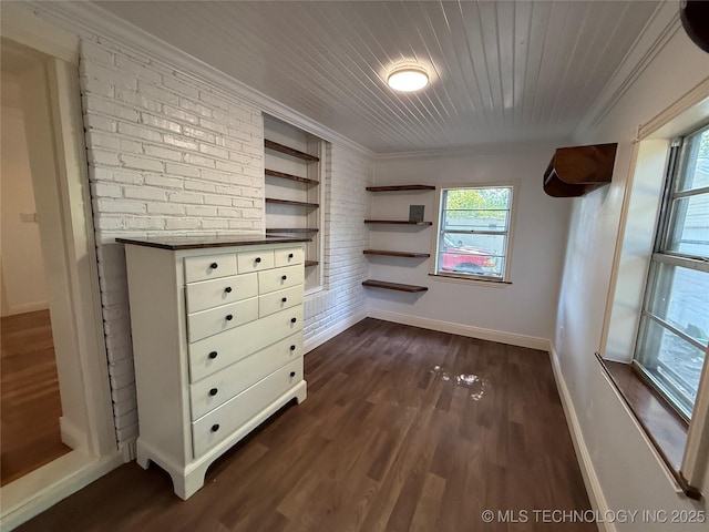 2109 Delaware St, Muskogee, OK 74403 - unfurnished room featuring baseboards, dark wood-type flooring, crown molding, built in shelves, and wood ceiling