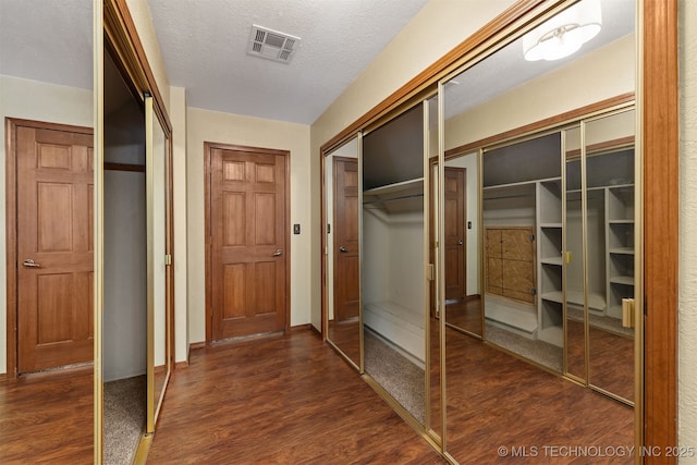 3508 Kimberlea, Muskogee, OK 74403 - hall with dark wood finished floors, baseboards, and a textured ceiling