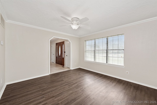 3508 Kimberlea, Muskogee, OK 74403 - unfurnished room with a ceiling fan, wood finished floors, baseboards, arched walkways, and ornamental molding