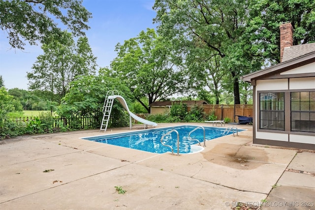 3508 Kimberlea, Muskogee, OK 74403 - view of swimming pool with a water slide, a patio area, and a diving board