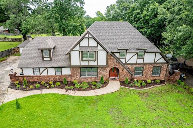 3508 Kimberlea, Muskogee, OK 74403 - tudor home featuring stucco siding, brick siding, and a shingled roof