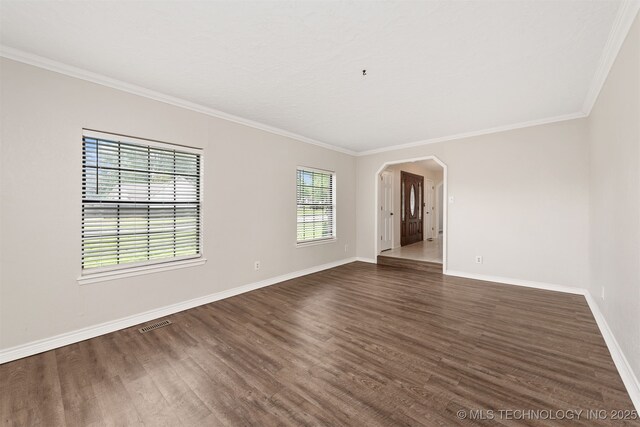 3508 Kimberlea, Muskogee, OK 74403 - unfurnished room featuring ornamental molding, dark wood finished floors, baseboards, and arched walkways