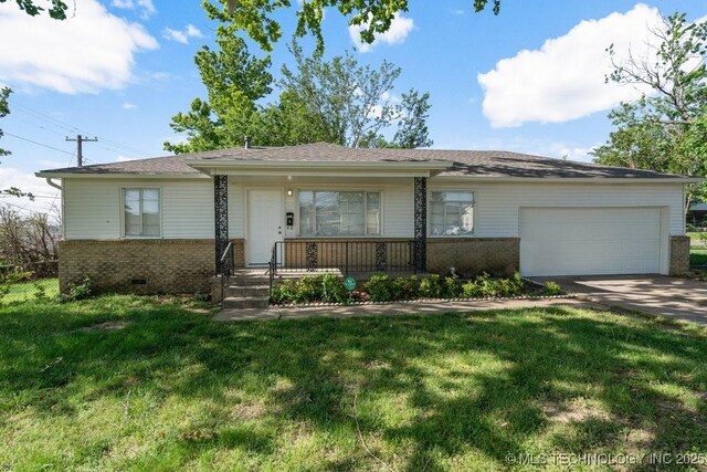 6210 E 17th St, Tulsa, OK 74112 - ranch-style house featuring brick siding, a garage, driveway, and a front lawn