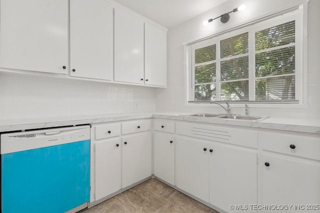 6210 E 17th St, Tulsa, OK 74112 - kitchen with dishwasher, a sink, light countertops, and white cabinetry