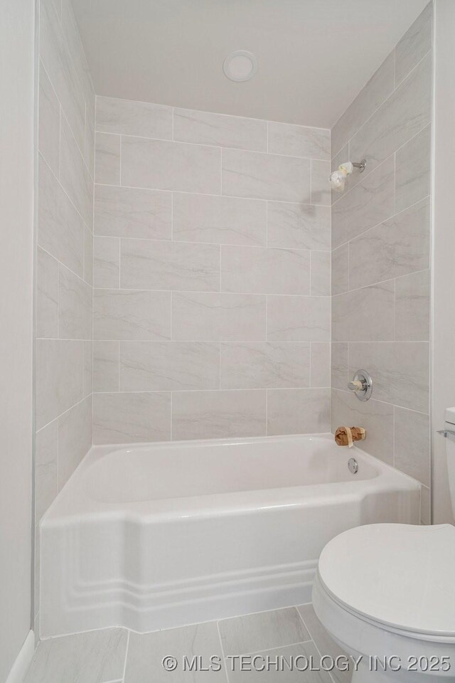 6210 E 17th St, Tulsa, OK 74112 - bathroom with toilet, tile patterned floors, and  shower combination